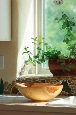 Laura Ramberg, a friend and local artist, created a custom tile backsplash that adds depth and charm.